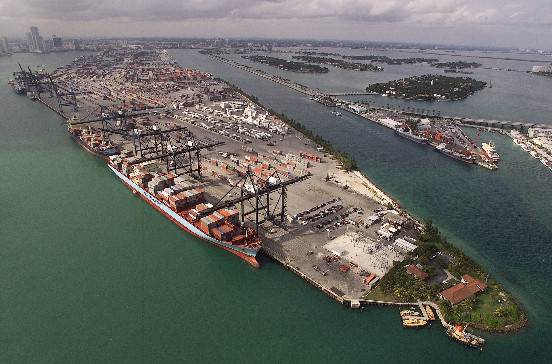 Aerial view of container stacks and cranes at a port